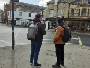 two students stood by the junction