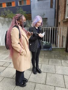 two students stood outside of de grey