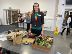 Campus Energy and Environmental Projects Officer Sarah Williams with some of the donated locally grown vegetables at the Living Lab launch