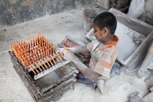 Child working in dangerous conditions manufacturing products