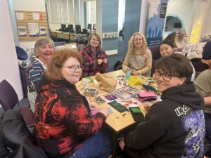 Tadcrafters and participants making sewing kits