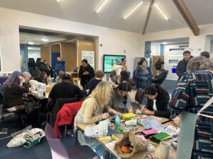 general view of participants of the Repair Fair across the Holgate concourse