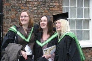 Meral (right) graduating with friends