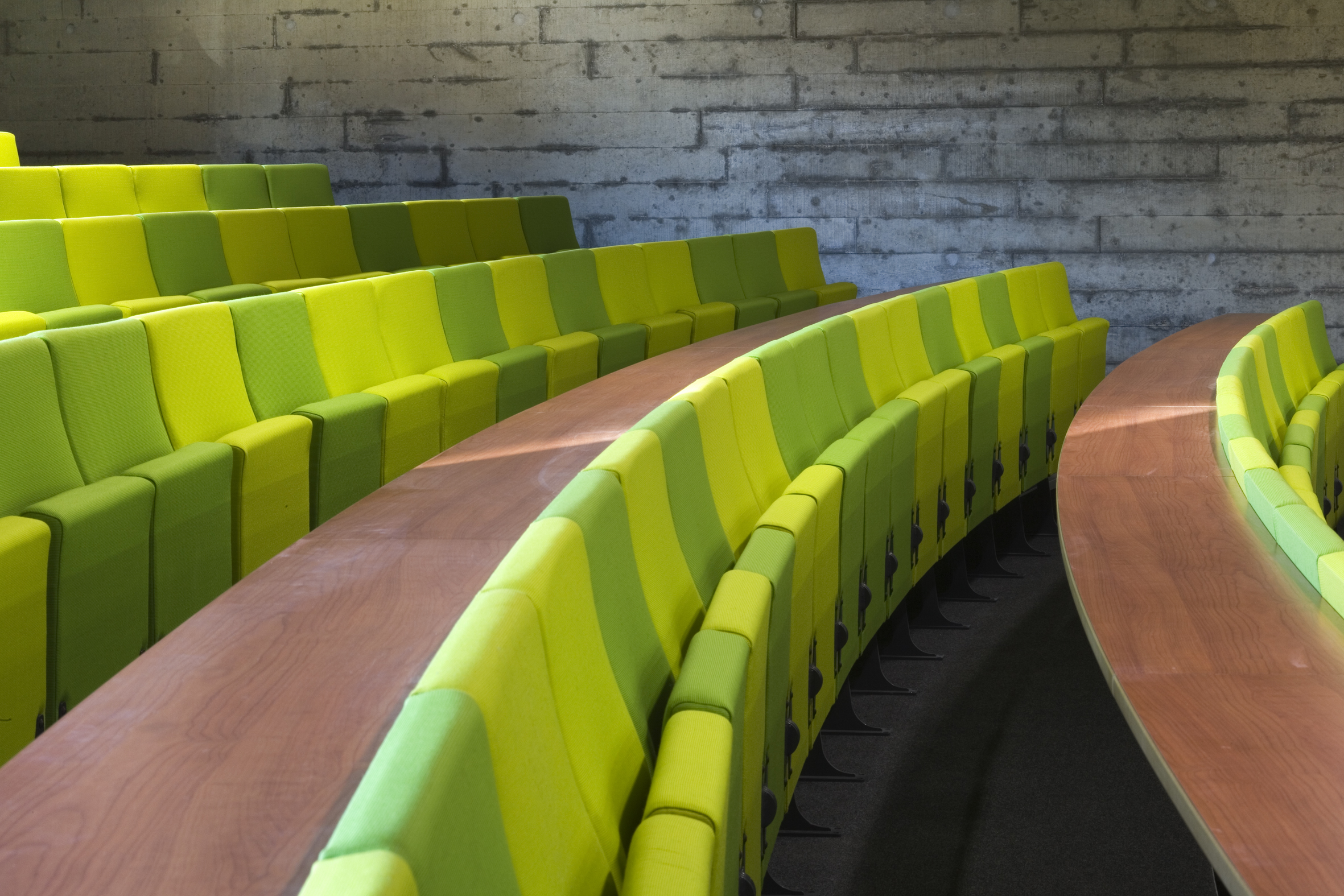 Rows of two-toned green seating in a lecture theatre in De Grey.