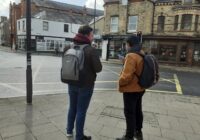 two students stood by the junction