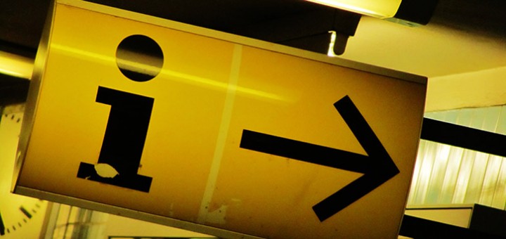 Photograph of an information point 'i' arrow to symbolise access to information.