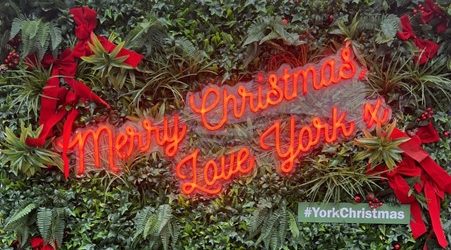 Image of a neon sign reading 'Merry Christmas, Love York x'