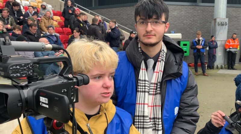 Image of students filming at the LNER stadium